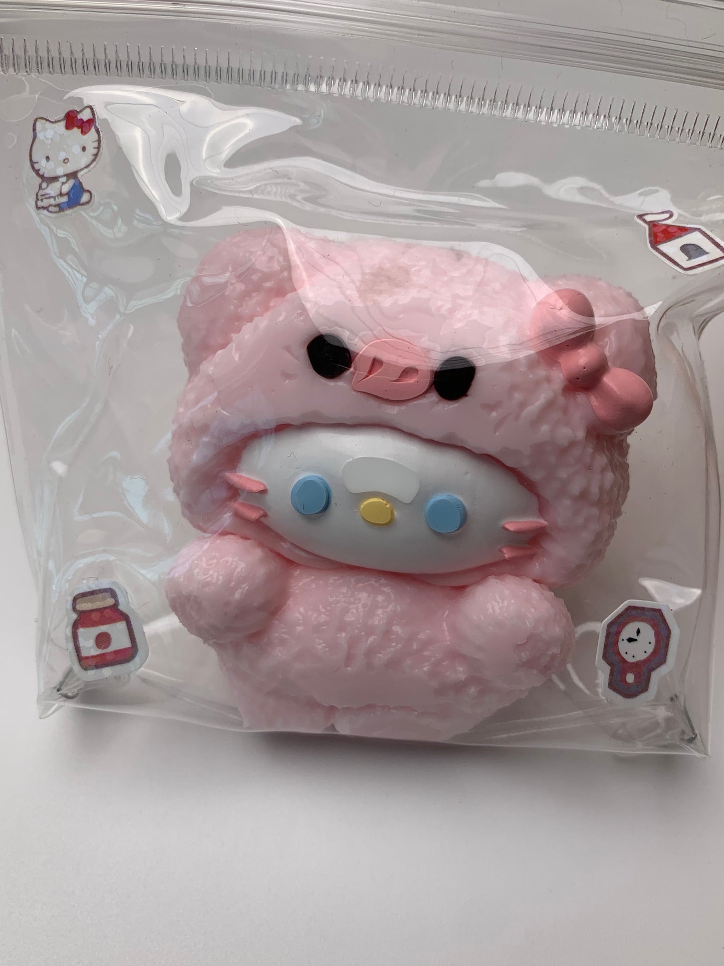 Hello kitty wearing piggy suit